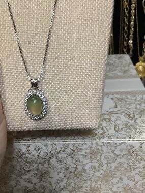 Silver Necklace with Green Oval Cabochon and Halo